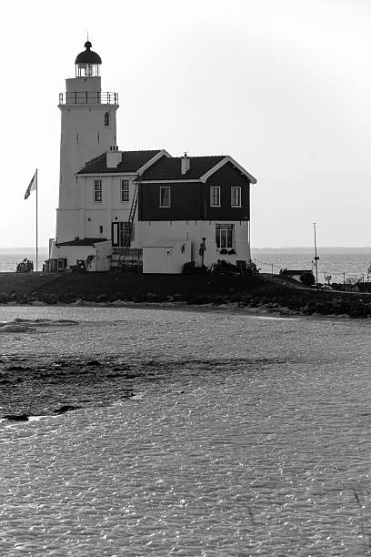 istock Beautiful beach and lighthouse at sunrise 178432670