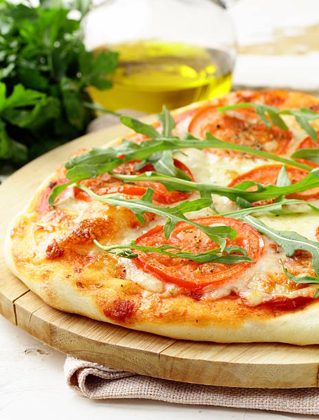 istock Margarita pizza with tomatoes and  arugula 178432700