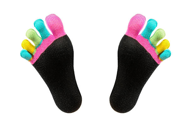 Two Feet In Happy Socks With Toes Stock Photo - Download Image Now - Sock,  Cut Out, Adult - iStock