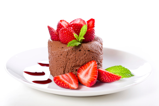 Close up photograph of a chocolate mousse with strawberries
