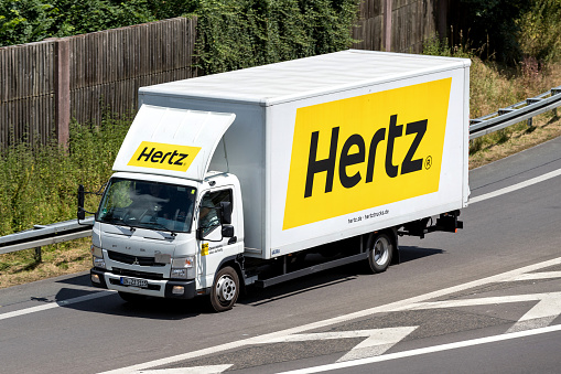 Wiehl, Germany - June 30, 2018: Mitsubishi Fuso Canter of Hertz on motorway