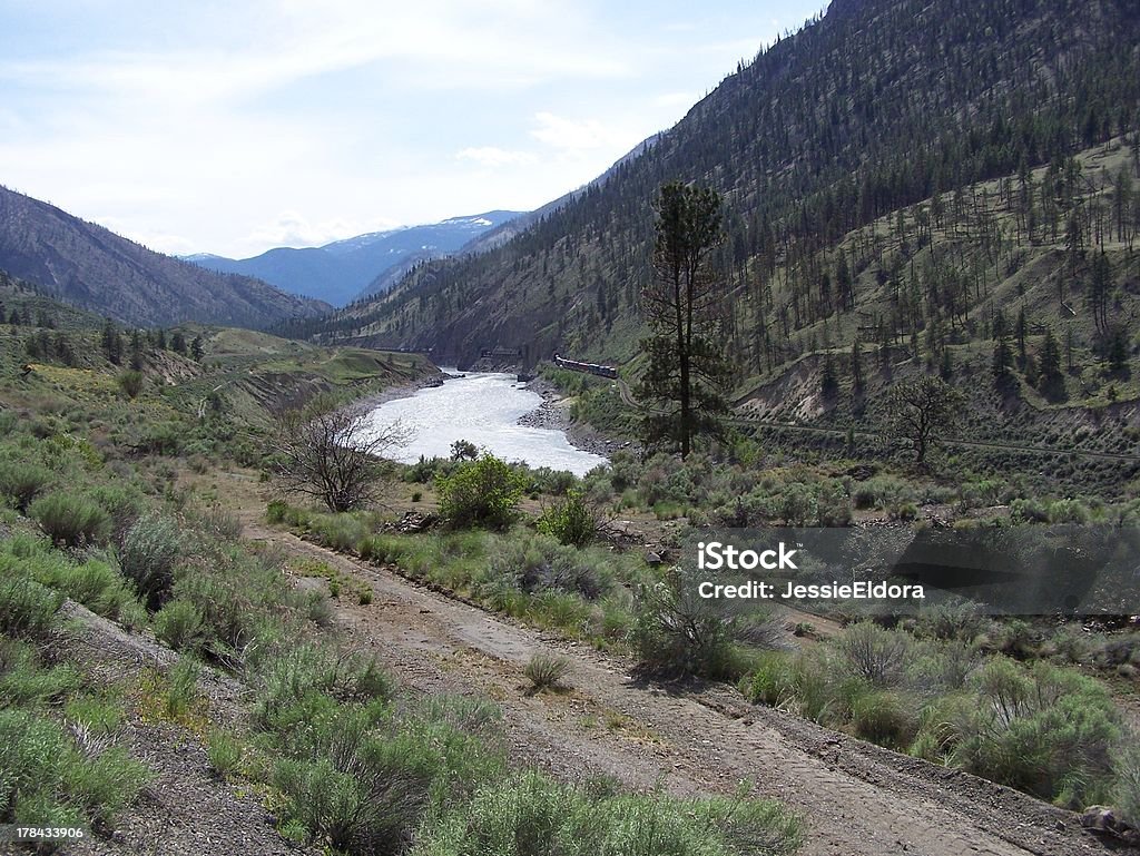 Dirt roads and railway tracks Traveling past the Cariboo country and heading to the coastal area of British Columbia. British Columbia Stock Photo