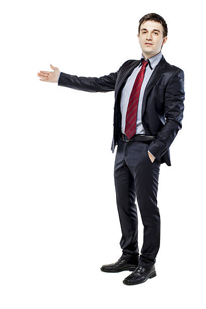 istock young attractive business man in black suite on white background 178434763