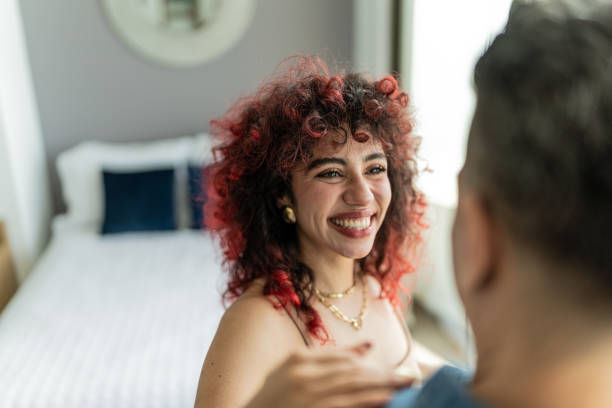 istock Young woman talking with her husband at hotel room 1784362076