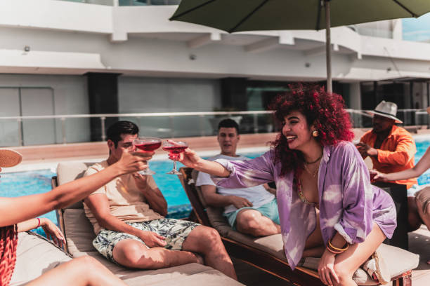 istock Young woman toasting with her friends at hotel 1784384849