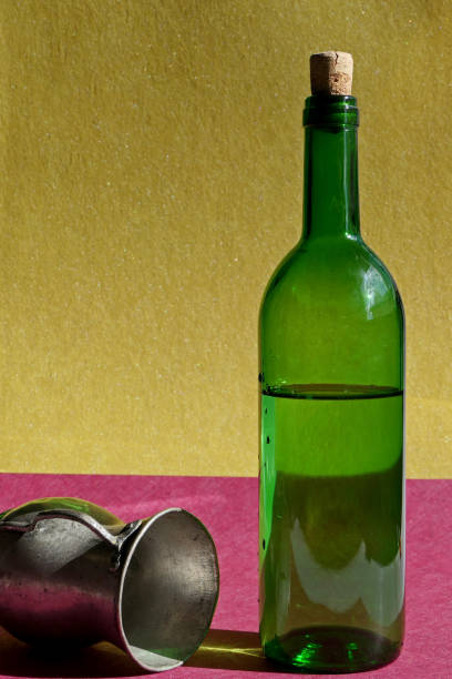 istock antique copper mug and wine bottle on the table 1784385436