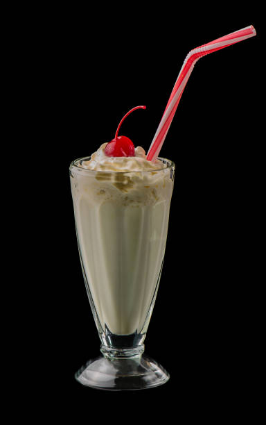 istock vanilla milkshake and cherry isolated on black background 1784387144