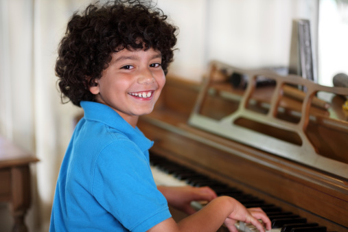 Boy Learning Playing Piano From Private Teacher