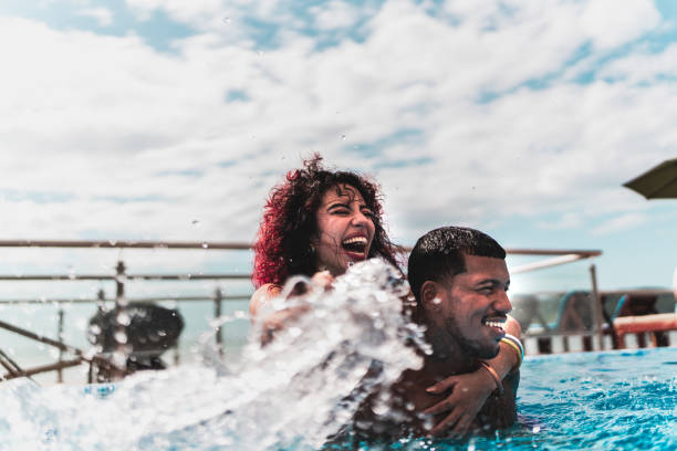 istock Friends playing in the pool at hotel 1784399565