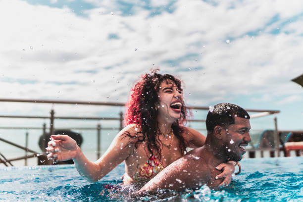 Friends playing in the pool at hotel