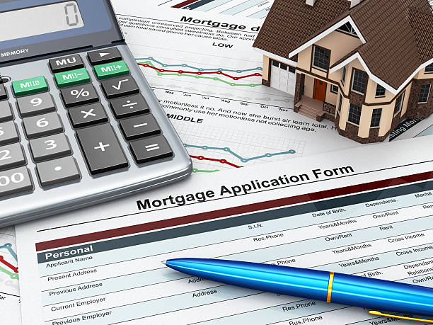 istock Mortgage application form with a calculator and house. 178440305