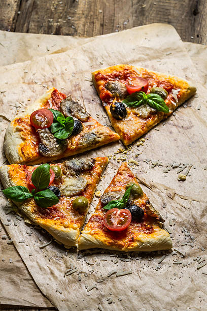 istock Homemade pizza with mushrooms on baking paper 178440907