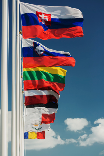 Row of  some European country  flags against blue sky background