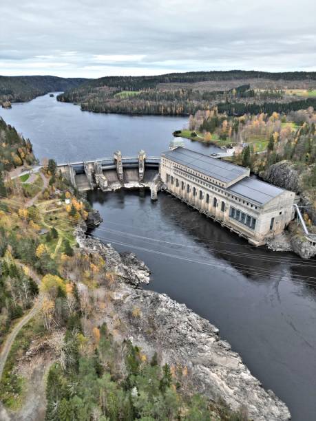 istock a dam that is on the edge of a river with trees 1784426649