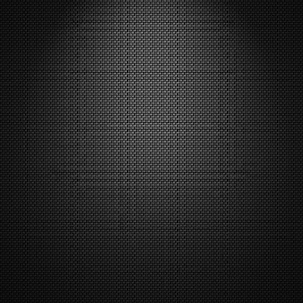 Carbon fibre texture background slightly lit from the top stock photo