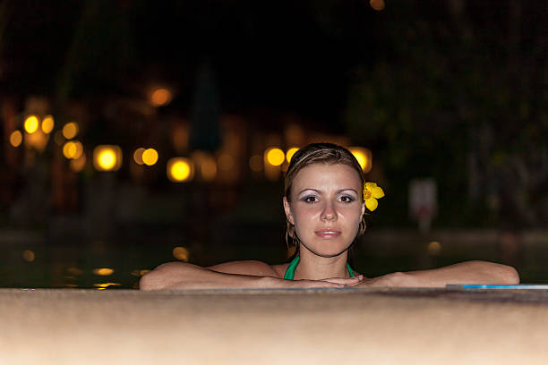 istock girl by the pool at sunset 178443073