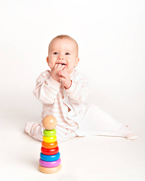 istock Happy baby playing with a toy pyramid 178443338