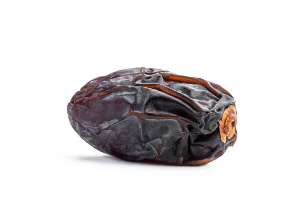 istock Dried dates fruits top view on white background 1784437648