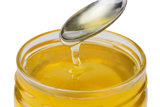 istock A spoon scoops up acacia honey. 1784438746