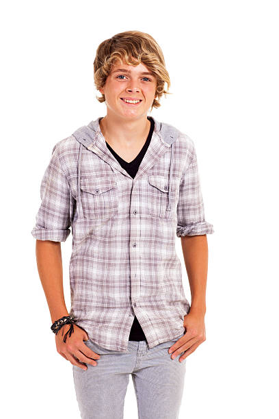 happy cute teenage boy studio portrait isolated on white