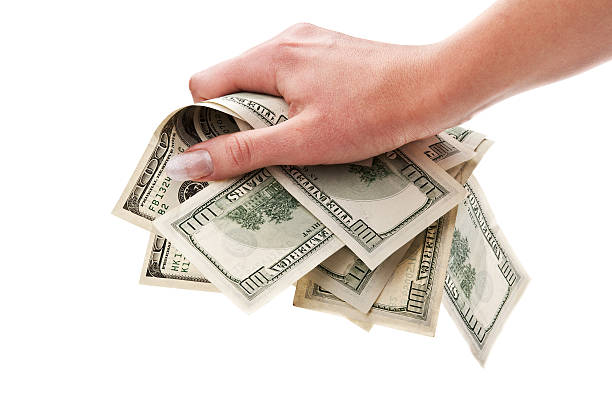 istock dollars in woman hand 178444682