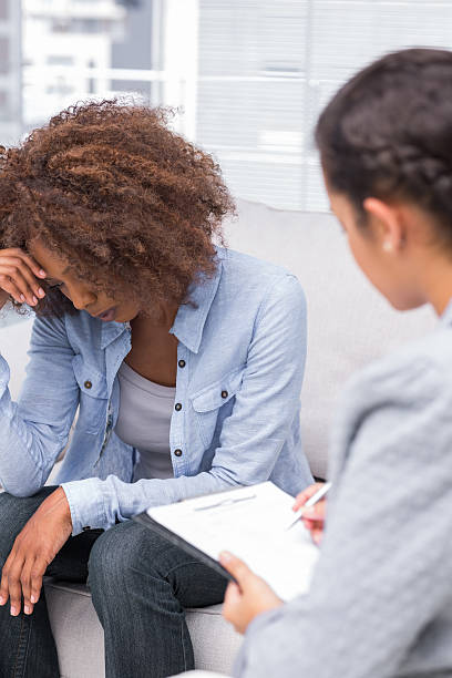 istock Upset woman crying on the sofa in therapy 178444778