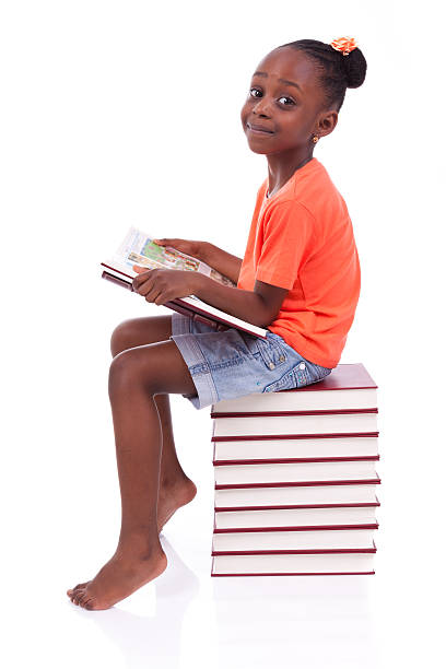 istock African-American girl reading atop stack of books 178444867