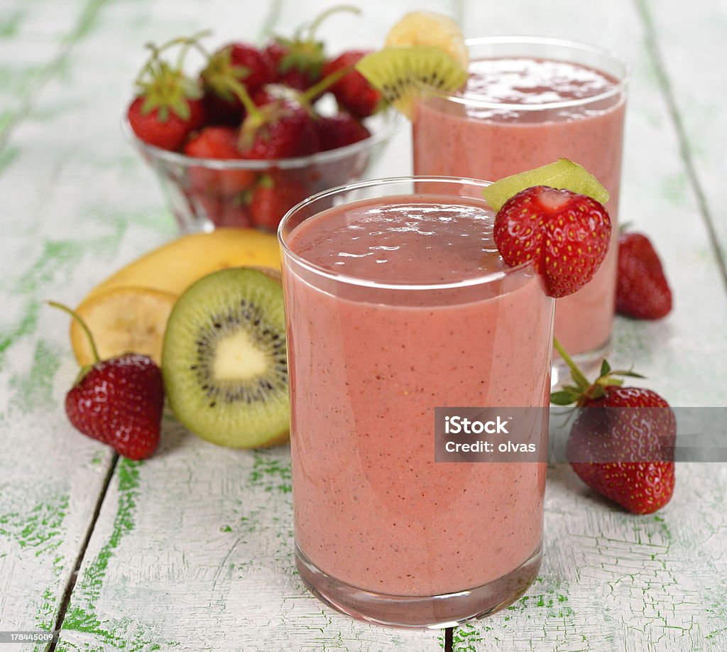 Smoothie of strawberries and kiwi Smoothie of strawberries and kiwi on a white table Color Image Stock Photo