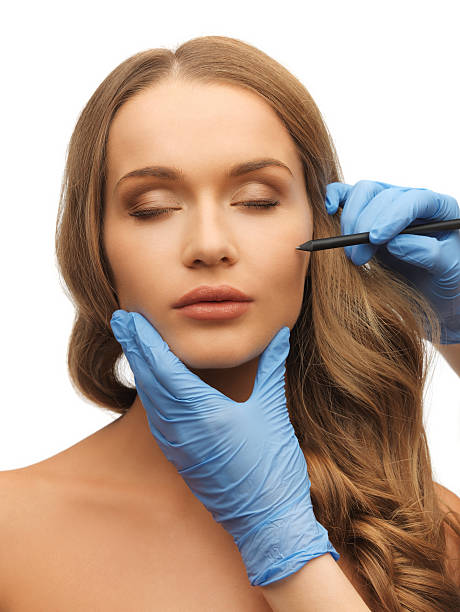 woman face and beautician hands