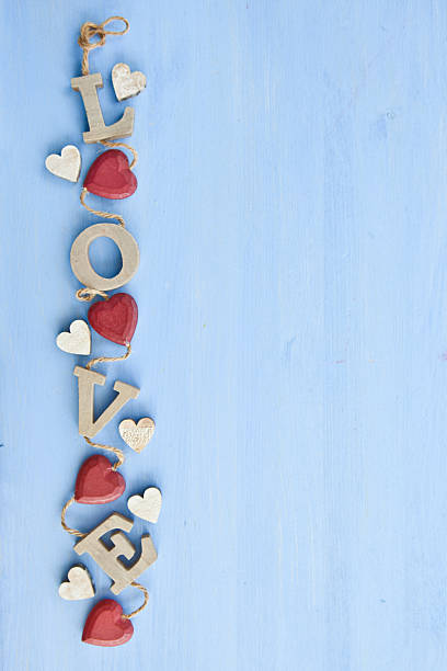 istock Blue background with LOVE in wooden letters 178445882
