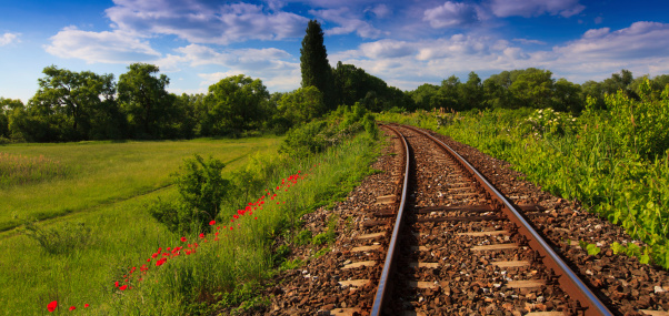 Scenic railroad in rural area in summer, in Eastern European countryside