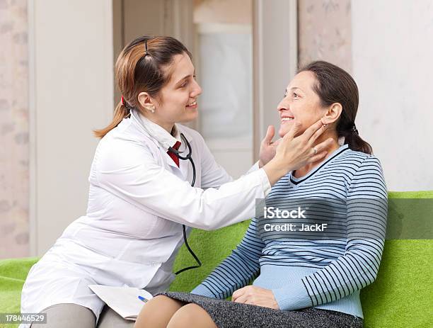 Doctor Examining Mature Woman Stock Photo - Download Image Now - Adult, Adults Only, Care