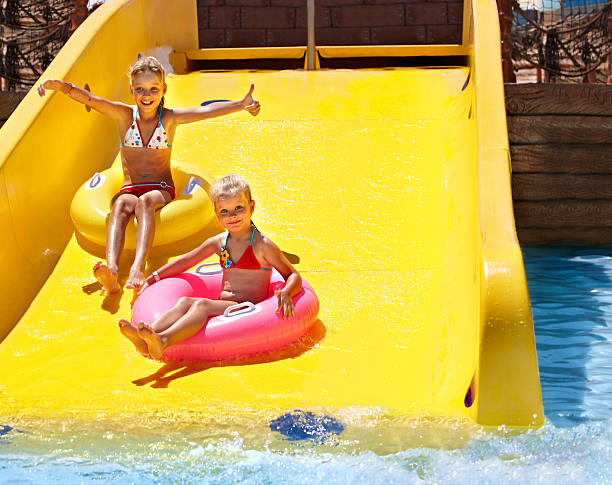 istock Child on water slide at aquapark. 178446923