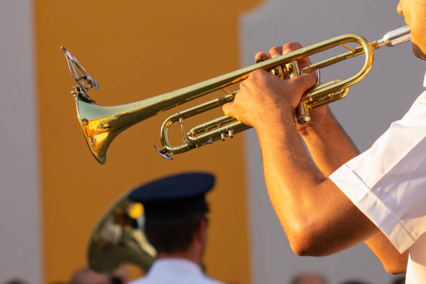 istock Military musician plays trumpets 1784474064
