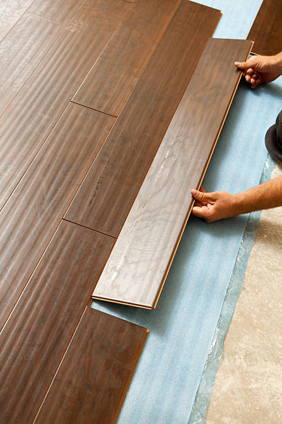 istock Man Installing New Laminate Wood Flooring 178447596