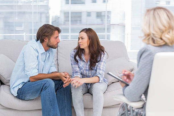 istock Couple looking to each other during therapy session 178447898