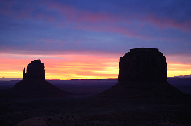 East Mitten and Merrick Buttes Sunrise, Monument Valley Beautiful Red East Mitten Butte Sunrise, Monument Valley (Navajo Permit on File) david merrick photos stock pictures, royalty-free photos & images