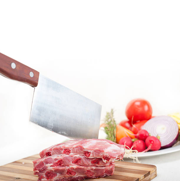 chopping fresh pork ribs and vegetables