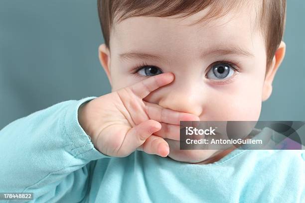 Close Up Of Baby Looking At Camera With Blue Eyes Stock Photo - Download Image Now - Baby - Human Age, Child, Eye