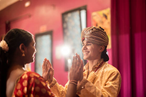 indian couple dancing at wedding in traditional dresses