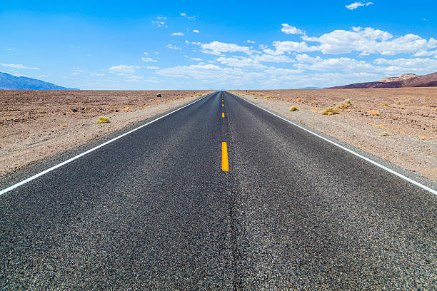 istock Death Valley road straight across the desert 178449244