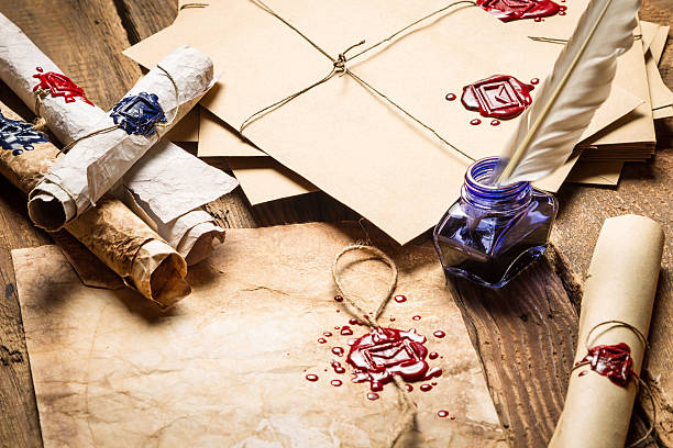istock Old rolls of paper, glasses and blue ink 178449839