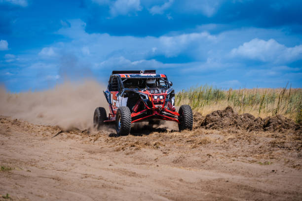 istock UTV buggy and 4x4 offroad in sandy track. Rally extreme riding 1784499578