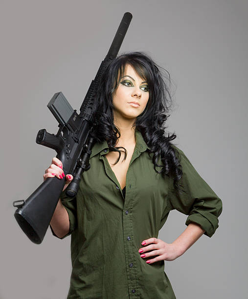 istock Sexy girl with machine gun 178450101