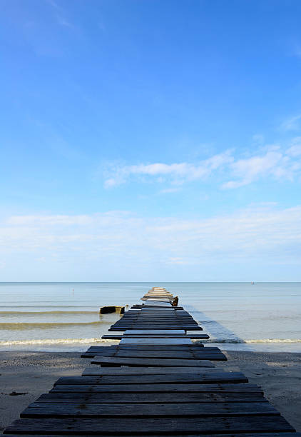 istock Old wood bridge on the beach 178450843