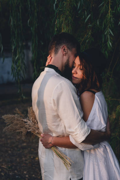istock Beautiful lovely bridal couple standing near willow tree 1784516666