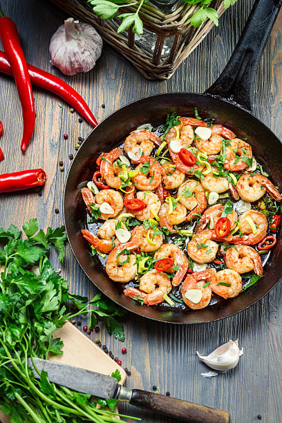istock Fresh vegetables and shrimps on old pan 178452453