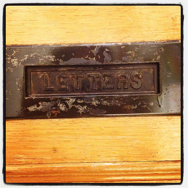 istock Mail Slot In Old Wood Door 178452668