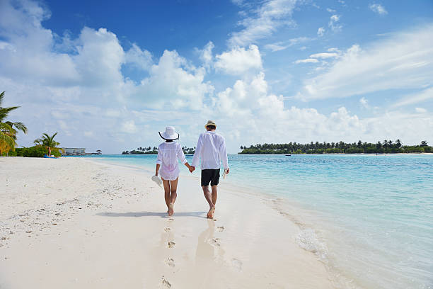istock happy young couple have fun on beach 178452888