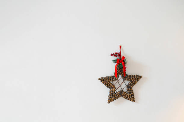Homemade Christmas star wreath on white background with copy space